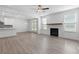 Spacious living room offering an open-concept space with a fireplace and a kitchen area at 4778 Moonstone Trce, Kennesaw, GA 30144