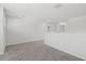 Open loft area with neutral carpet, white walls, and a bright, airy atmosphere at 4778 Moonstone Trce, Kennesaw, GA 30144