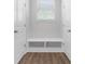 Mudroom with a built-in bench between doors, and a window at 4778 Moonstone Trce, Kennesaw, GA 30144