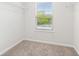 Walk-in closet with carpet, white walls, shelving and a window for natural light at 4778 Moonstone Trce, Kennesaw, GA 30144
