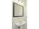 Bathroom with pedestal sink and modern lighting at 711 Cosmopolitan Ne Dr # 802, Atlanta, GA 30324