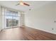 Bright bedroom with large windows and ceiling fan at 711 Cosmopolitan Ne Dr # 802, Atlanta, GA 30324
