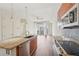 Modern kitchen with granite countertops, stainless steel appliances, and open layout to the living area at 711 Cosmopolitan Ne Dr # 802, Atlanta, GA 30324