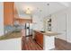 Stylish kitchen featuring granite countertops, stainless steel appliances, island and convenient laundry at 711 Cosmopolitan Ne Dr # 802, Atlanta, GA 30324