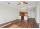 Bright, open-concept living area featuring hardwood floors, ample natural light, and a modern kitchen at 711 Cosmopolitan Ne Dr # 802, Atlanta, GA 30324