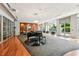 Bright lounge with piano, sleek lighting, and large windows offering a view of the outdoor area at 711 Cosmopolitan Ne Dr # 802, Atlanta, GA 30324