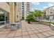 Inviting patio area with outdoor seating overlooking the pool and complex at 711 Cosmopolitan Ne Dr # 802, Atlanta, GA 30324