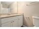 Bathroom vanity featuring granite countertops, cabinets, and a modern mirror and lighting at 120 E Cainwood E Ct, Atlanta, GA 30349