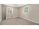 Carpeted bedroom featuring two windows and neutral colored walls, perfect for relaxation at 120 E Cainwood E Ct, Atlanta, GA 30349