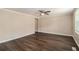 Bright living room with wood-look floors, neutral wall paint, white trim and a ceiling fan at 120 E Cainwood E Ct, Atlanta, GA 30349