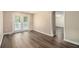 Spacious living room featuring hardwood floors and french doors to the backyard at 120 E Cainwood E Ct, Atlanta, GA 30349