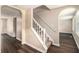 Interior stairway with neutral colors, carpeted steps, wood look floors and access to the second floor at 120 E Cainwood E Ct, Atlanta, GA 30349
