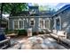 Charming backyard featuring a stone patio, outdoor seating, grill, and lovely landscaping at 2811 Alpine Ne Rd, Atlanta, GA 30305