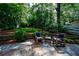 Scenic backyard with a stone patio and wooded surroundings, ideal for enjoying nature at 2811 Alpine Ne Rd, Atlanta, GA 30305