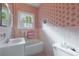 Vintage bathroom with pink flower wallpaper, white tile, and a small bathtub at 2811 Alpine Ne Rd, Atlanta, GA 30305