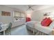 Bedroom with a ceiling fan, pink accents, and a desk near the window at 2811 Alpine Ne Rd, Atlanta, GA 30305