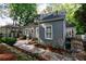 Exterior of the home with a patio, grill, landscaping, and a charming backyard setting at 2811 Alpine Ne Rd, Atlanta, GA 30305