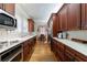 Spacious kitchen with wood cabinets, stainless steel appliances, and hardwood floors at 2811 Alpine Ne Rd, Atlanta, GA 30305