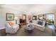 Bright living area featuring hardwood flooring, a fireplace, and seamless flow into the dining room at 2811 Alpine Ne Rd, Atlanta, GA 30305