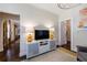 Cozy living space featuring modern media console, hardwood floors and neutral color palette at 2811 Alpine Ne Rd, Atlanta, GA 30305