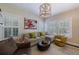 Comfortable living room featuring a unique light fixture and plantation shutters at 2811 Alpine Ne Rd, Atlanta, GA 30305