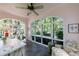Bright sunroom with expansive windows, cozy seating, and views of the backyard at 2811 Alpine Ne Rd, Atlanta, GA 30305