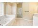 Bright bathroom featuring a jacuzzi tub and glass shower stall at 412 Middlebrooke St, Canton, GA 30115