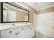 Bright bathroom features double sink vanity with granite counters and a large mirror at 412 Middlebrooke St, Canton, GA 30115