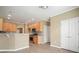 An open-concept kitchen with granite countertops and stainless steel appliances at 412 Middlebrooke St, Canton, GA 30115