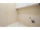 Small laundry area featuring tile flooring, and storage cabinets at 412 Middlebrooke St, Canton, GA 30115