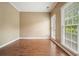 An empty living room featuring wood floors and a large window at 412 Middlebrooke St, Canton, GA 30115