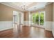 A spacious living room with wood floors, trim, and natural light at 412 Middlebrooke St, Canton, GA 30115