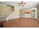 Spacious living room with hardwood floors, staircase, and an open view to the kitchen at 412 Middlebrooke St, Canton, GA 30115