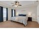 A large bedroom includes recessed lights, soft carpet, and side tables at 5807 Mitchell Chase Trl, Mableton, GA 30126