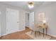 A bright bedroom with a desk, neutral walls, and carpet offers a calming and functional space at 5807 Mitchell Chase Trl, Mableton, GA 30126