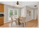 Bright breakfast nook with a round table, comfortable chairs, and french doors leading to the exterior at 5807 Mitchell Chase Trl, Mableton, GA 30126