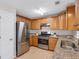 Well-equipped kitchen with stainless steel appliances, granite counters, and ample cabinet space at 5807 Mitchell Chase Trl, Mableton, GA 30126