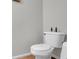 A clean white toilet and a neutral wall color offer a modern bathroom design at 5807 Mitchell Chase Trl, Mableton, GA 30126