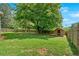 Fenced in backyard with a shed at 161 Old Vandiver Dr, Canton, GA 30114