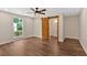 Bright bedroom with ample natural light, hardwood flooring, ceiling fan, and access to ensuite bathroom at 161 Old Vandiver Dr, Canton, GA 30114