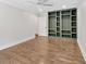 Bright bedroom boasts hardwood floors, neutral walls, an updated ceiling fan, and a spacious closet at 161 Old Vandiver Dr, Canton, GA 30114