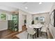 Bright dining room featuring modern table, stylish chairs, elegant china cabinet, and french doors to patio at 161 Old Vandiver Dr, Canton, GA 30114