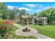 Inviting single-story home with a covered porch, landscaped yard, a stone walkway, and decorative fountain at 161 Old Vandiver Dr, Canton, GA 30114