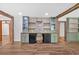 Kitchen with custom cabinets and wood accents with brick accent wall and beverage bar at 161 Old Vandiver Dr, Canton, GA 30114