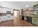 Kitchen with stainless appliances, stone counters and brick accent wall at 161 Old Vandiver Dr, Canton, GA 30114