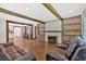 Inviting living room with decorative fireplace, wood beams and open concept at 161 Old Vandiver Dr, Canton, GA 30114