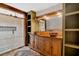 Luxury main bathroom boasts dual sinks, custom wood cabinets, and a spacious glass shower at 161 Old Vandiver Dr, Canton, GA 30114