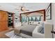 Bright main bedroom boasts hardwood floors, a ceiling fan, a large closet and an attached sitting area at 161 Old Vandiver Dr, Canton, GA 30114