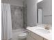 Bathroom with a white vanity, tiled shower, and elegant fixtures at 330 La Perla Dr, Sugar Hill, GA 30518