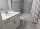 Bathroom featuring a vanity with drawers, white toilet, and a tub with white shower curtain at 330 La Perla Dr, Sugar Hill, GA 30518